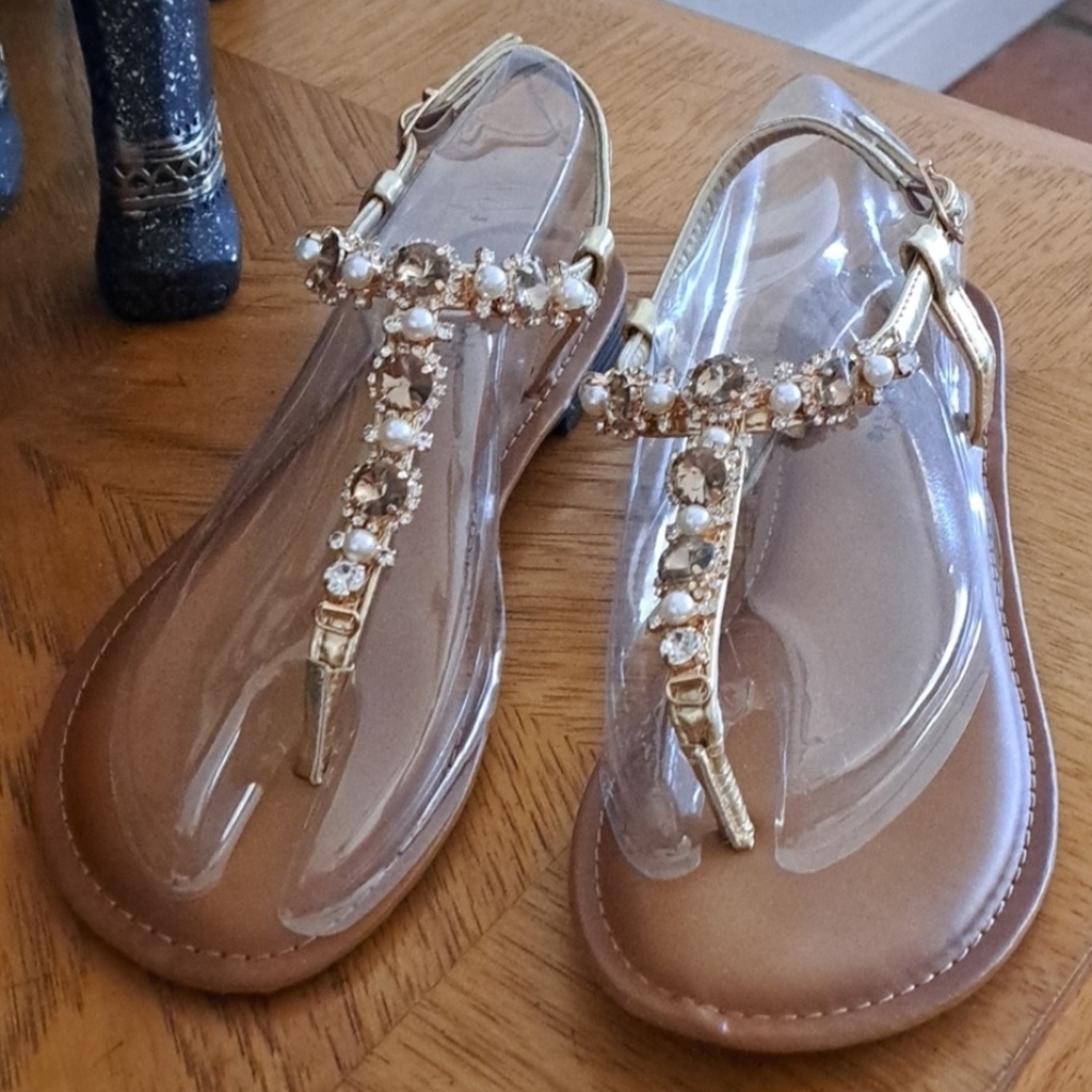 Gold and Brown T-Strap Sandals with Metallic Accents